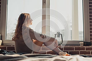 Woman sitting at the window