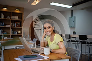 Woman sitting working with laptop at coffee shop, freelance woman working outside Concept