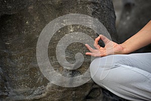 Woman sitting in yoga lotus pose