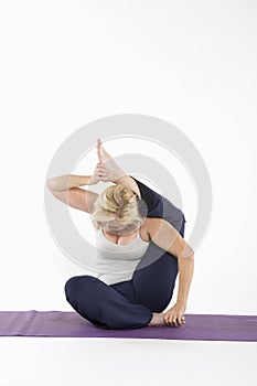Woman sitting in yoga posture