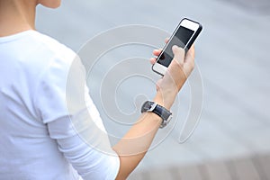 Woman skateboarder use cellphone taking photo