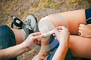 Woman skater with injured leg knee