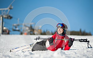 Woman skier with ski at winer resort in sunny day