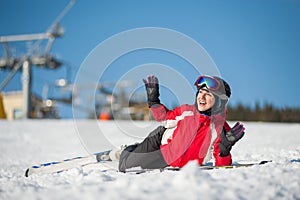 Woman skier with ski at winer resort in sunny day