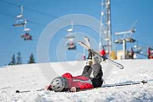 Woman skier with ski at winer resort in sunny day