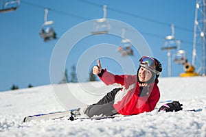 Woman skier with ski at winer resort in sunny day