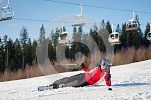 Woman skier with ski at winer resort in sunny day