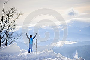 Woman skier on top of the mountain. Winter sports concept