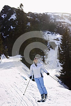 Woman Skiing Down Slope