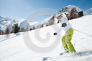 Woman skiing downhill photo