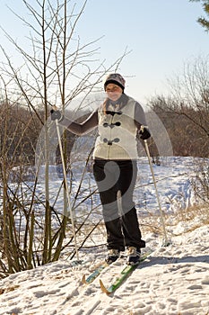 Woman skiing in the forest healthy lifestyle