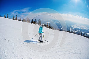 Woman is skiing in the mountains Sheregesh