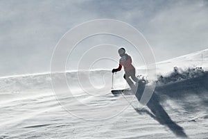 Woman skiing on snowy hill at Breckenridge ski resort. Extreme winter sports.