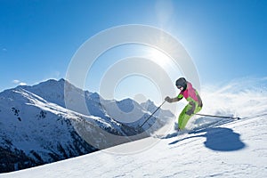 Woman is skiing in a winter paradise