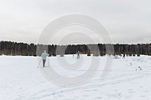 Woman skiing in winter woods