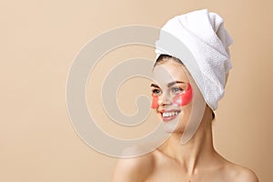 woman skin care face patches bare shoulders  background