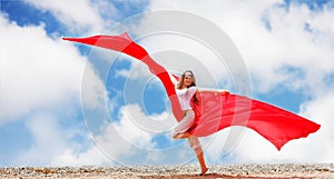 Woman on sky background with red tissue