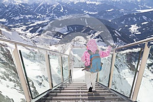 Woman on skywalk on Dachstein mountain photo