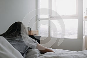 Woman sleep on tablet computer on bed in the morning. Early online work.