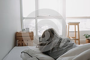 Woman sleep on tablet computer on bed in the morning. Early online work.