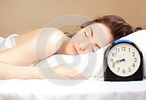 Woman sleeping in bed (focus on woman)