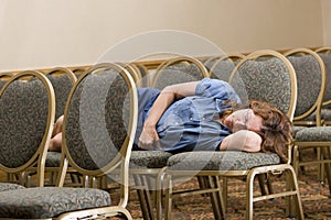 Woman sleeping at boring conference