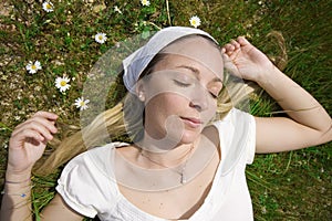 Woman sleeping in field