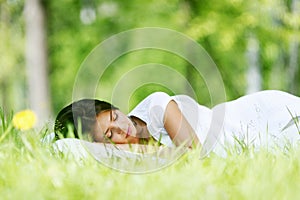 Woman sleeping on grass