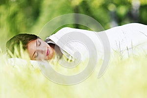 Woman sleeping on grass