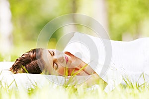 Woman sleeping on grass