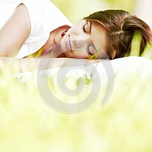 Woman sleeping on grass