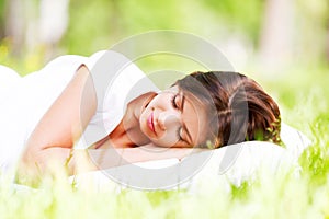 Woman sleeping on grass