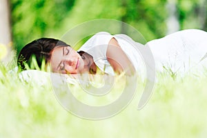 Woman sleeping on grass