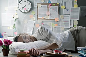 Woman sleeping in office overnight photo