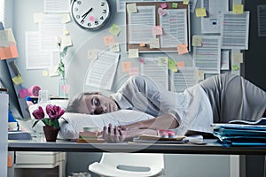 Woman sleeping in office overnight photo