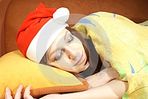 Woman sleeping with Santa hat