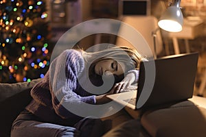 Woman sleeping on the sofa on Christmas Eve