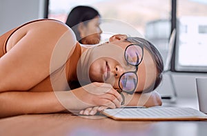 Woman, sleeping and tired at desk in office with notebook for creativity, ideas and fatigue at media agency. Person