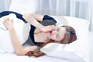 Woman sleeping on a white mattress Concepts of sleep and rest for good health