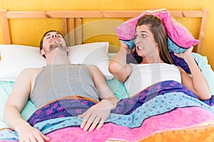 Woman is sleepless and angry because of her snoring husband