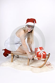 Woman on a sleigh with gift