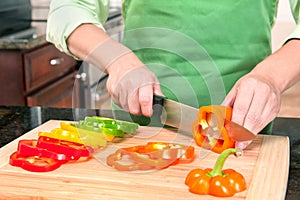Woman Slicing Bell Peppers photo