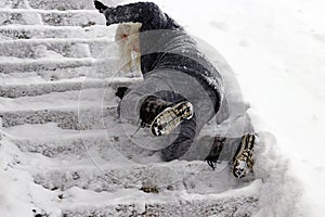 A woman slipped and fell on a wintry staircase