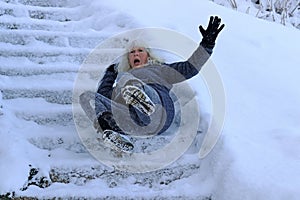 A woman slipped and fell on a wintry staircase photo