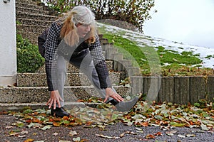 A woman slipped on wet leaves and fell