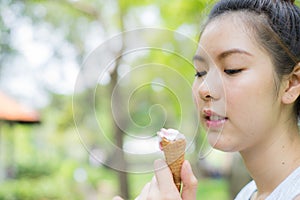Woman sloppy from eating ice cream cone. with copy space for text