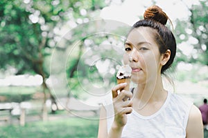 Woman sloppy from eating ice cream cone. she happy and smile. with copy space