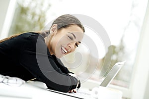 Woman slouched and resting on keyboard