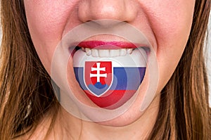 Woman with slovakian flag on the tongue