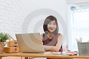 Woman small business owner, business start up conceptual, young